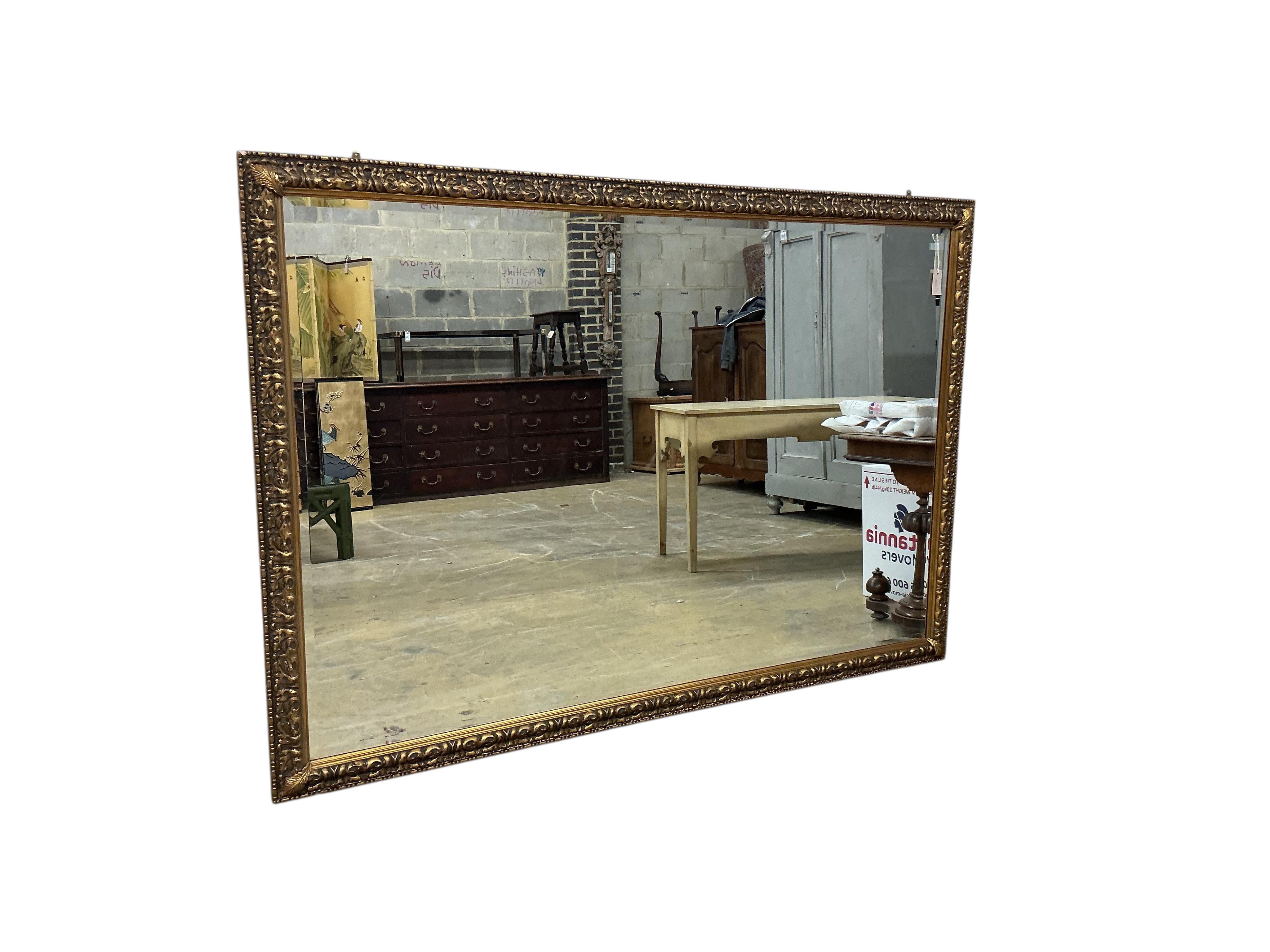 A large Victorian style rectangular gilt framed wall mirror, width 197cm, height 136cm